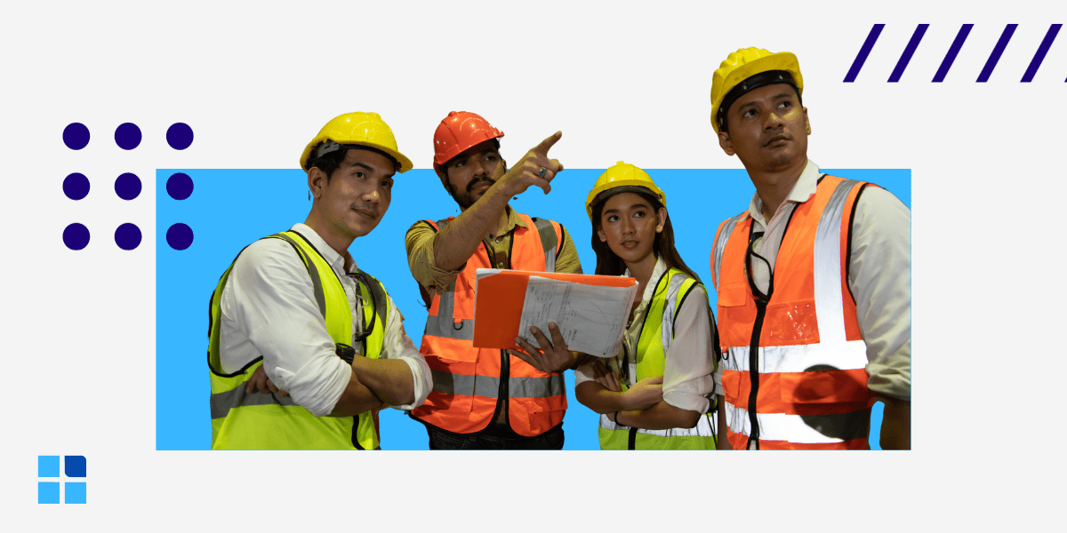 Four construction workers wearing safety vests and helmets review plans.