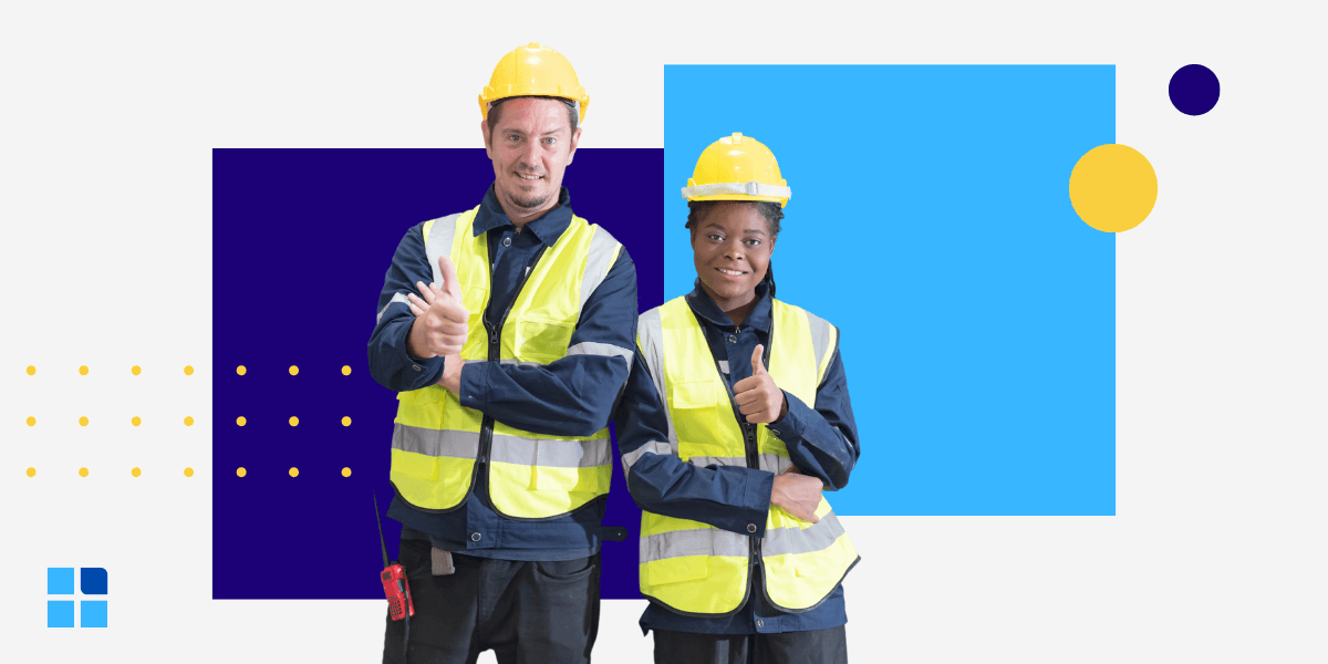 Two construction workers in yellow hard hats and reflective vests smile and give thumbs-up.