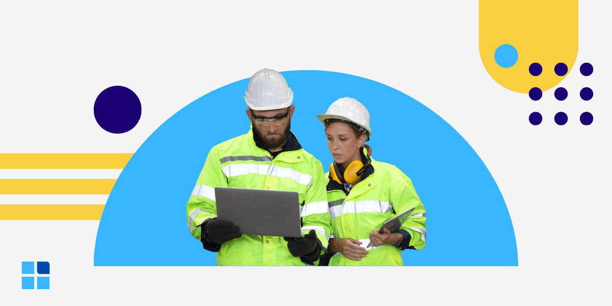Industrial workers collaborate on a laptop.
