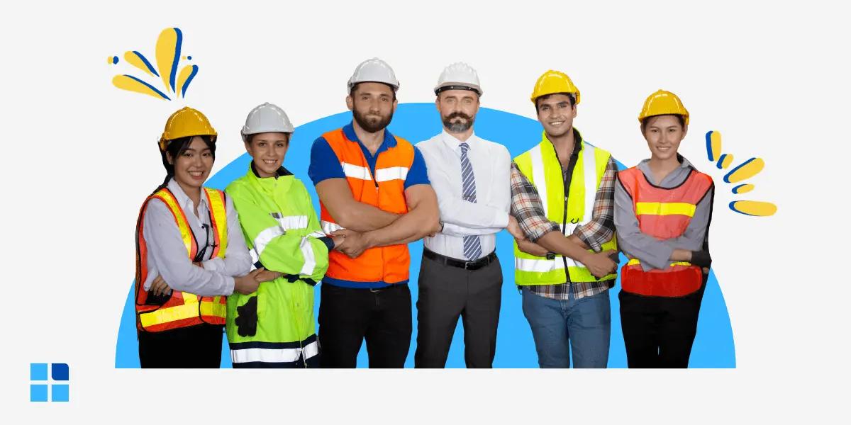 A diverse group of six construction workers, wearing safety gear and hard hats, stand together.