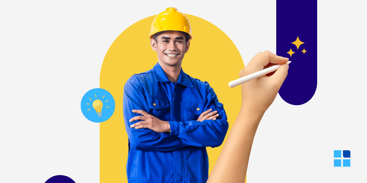 A smiling person in a blue uniform and yellow hard hat stands confidently with arms crossed.