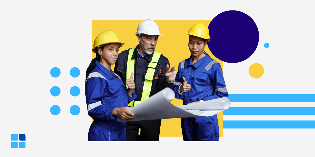 Three construction workers in helmets and uniforms discuss blueprints, conveying teamwork and focus.