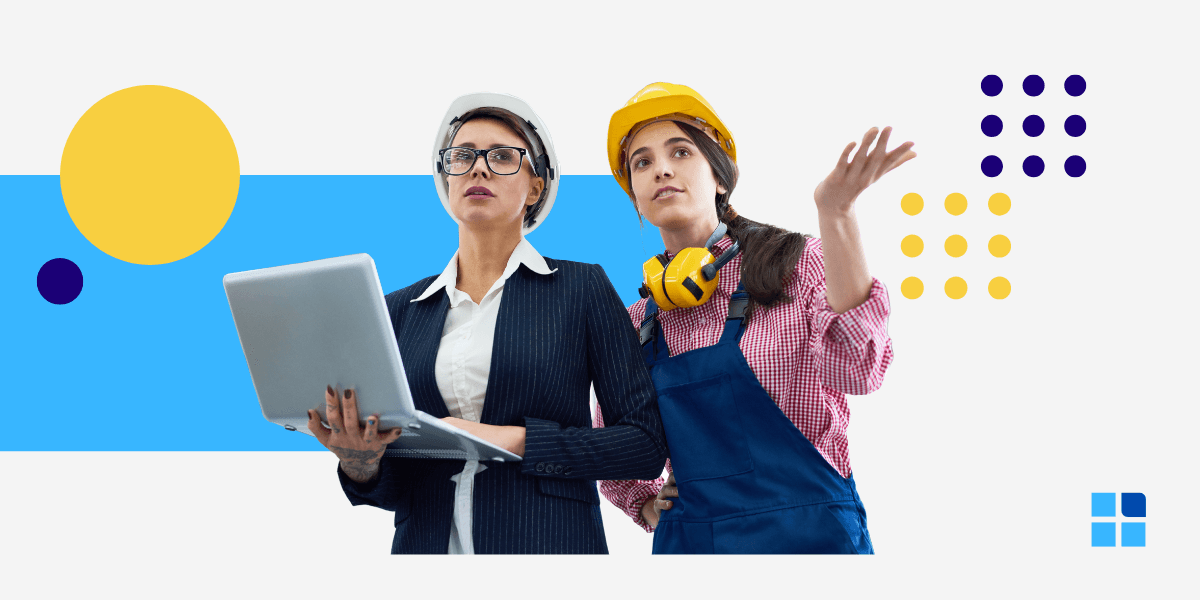 2 women stand together: 1 in business attire with a laptop, other in construction gear.