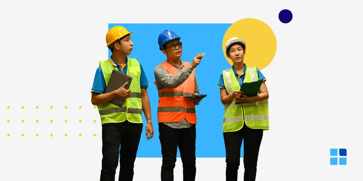 Three construction workers in safety gear—two in yellow helmets and one in blue.